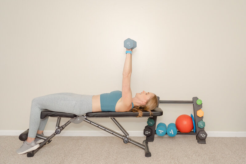 Woman using weights during Chantilly, Virginia branding pictures