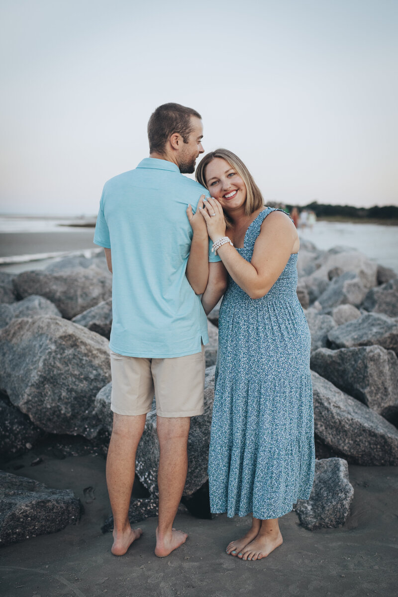 man and woman on the beach for family photos at Fripp island