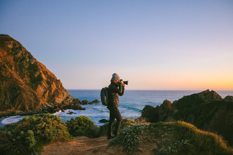 woman photographs landscape