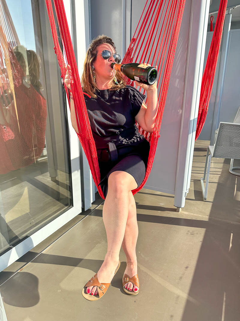 ally drinkin on a hammock virgin voyages