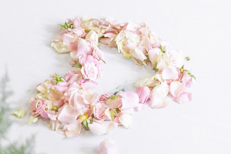 Sullivan Photography Wedding Detail Photo of Pink Flowers in the Shape of a Heart