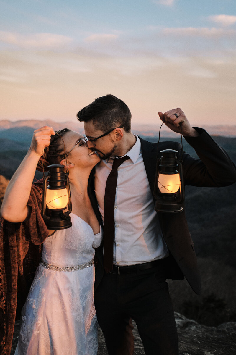 Eloping couple looks deeply at each other while the sun sets