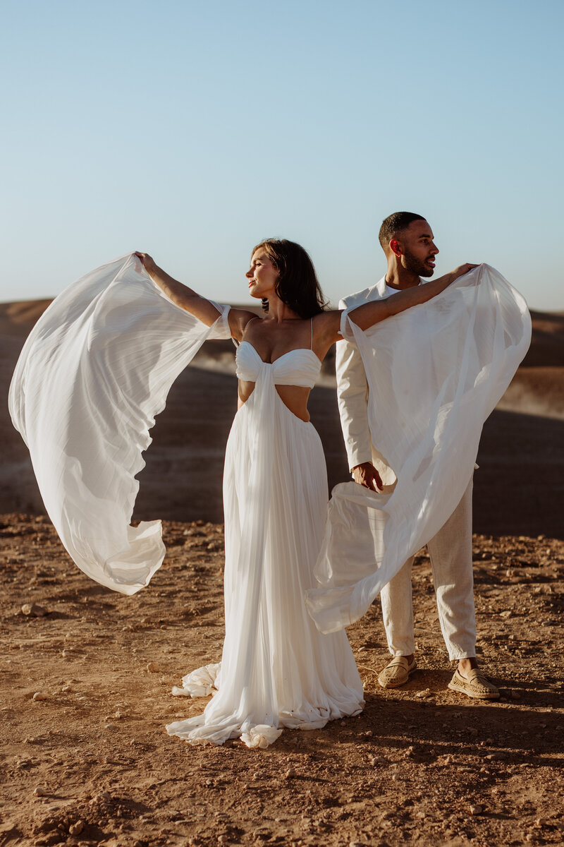 bride and groom in sand dunes