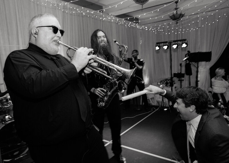 November wedding at Graylyn Estate, designed and planned by Charming Carolina — band member playing an instrument as guests dance during the reception.