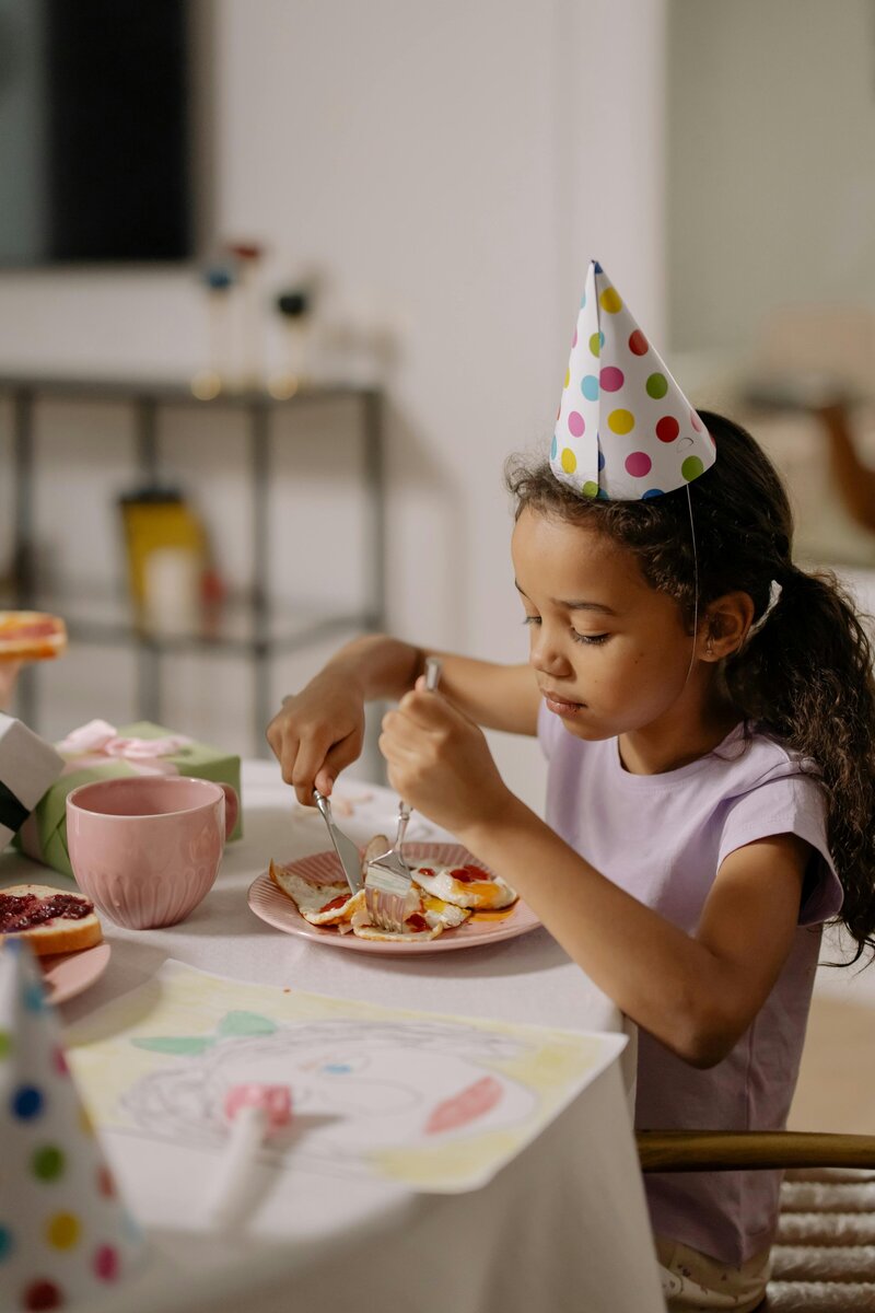 Parents and children enjoying a birthday party in the café space
