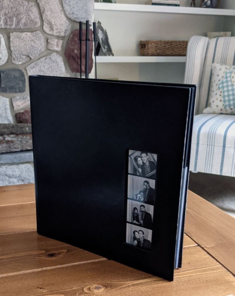 Wedding photo booth photo album with prints of guest pictures