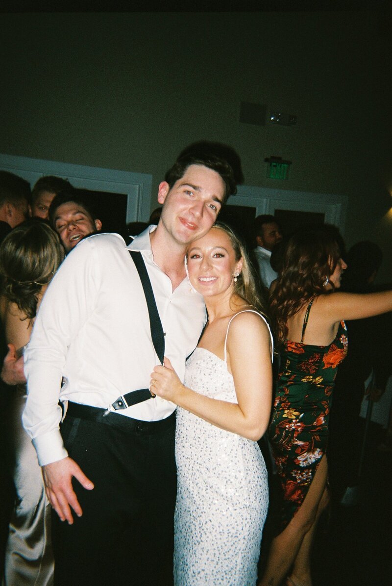 Flash film photo of bride and groom on  the dance floor at reception