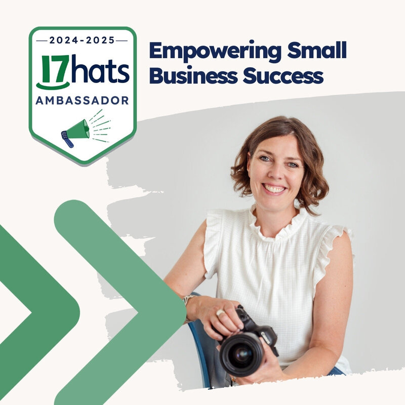 Calgary Brand Photographer Kate Daniel Photography in a white shirt and holding her camera while sitting in a chair. There is a 17hats 2024-2025 Ambassador graphic on the image, with green arrows.