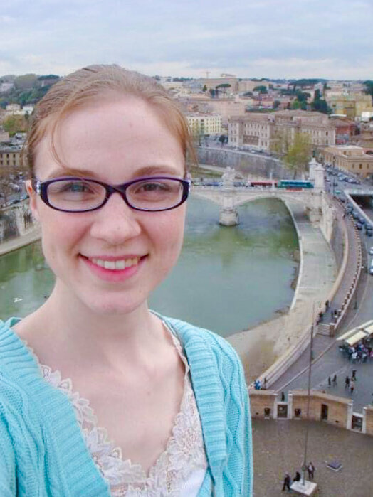 selfie of Erika Rene with Rome in the background