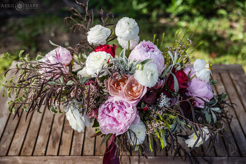 Pretty pink and white bohemian floral bouquet for an elopement in Colorado by Yarrow & Spruce