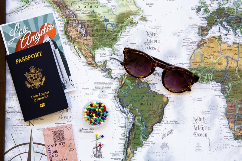 passport and glasses on a map