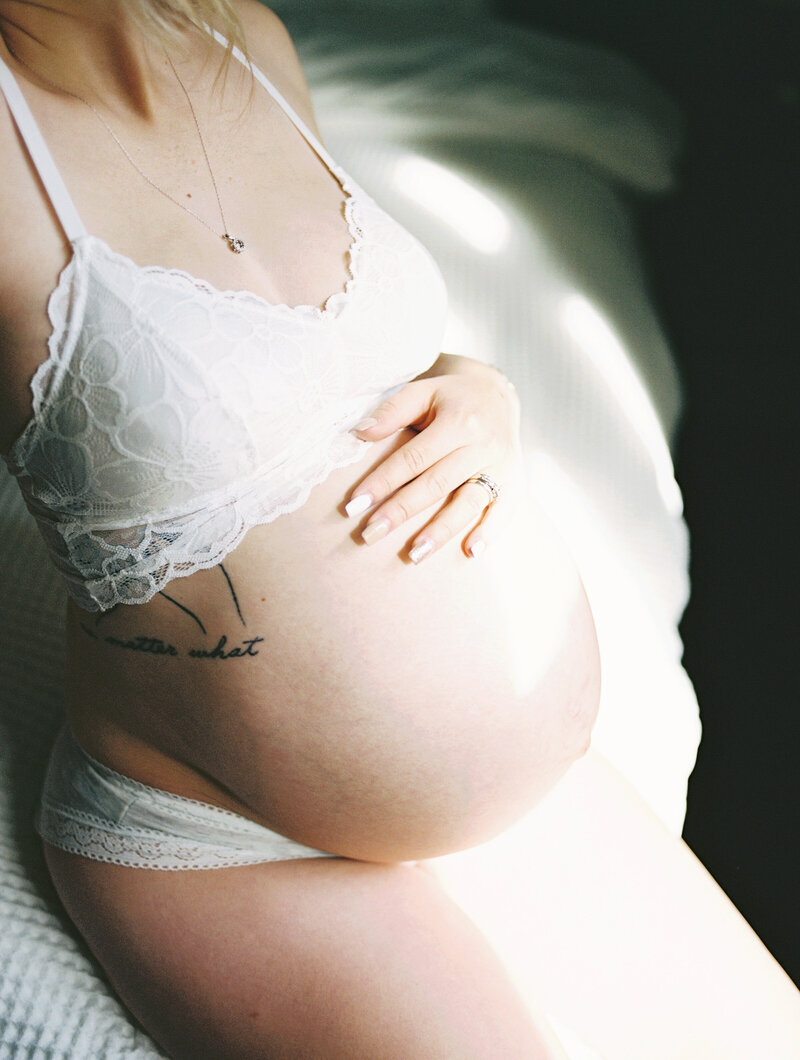 A photo taken during a beautiful intimate, at home maternity session