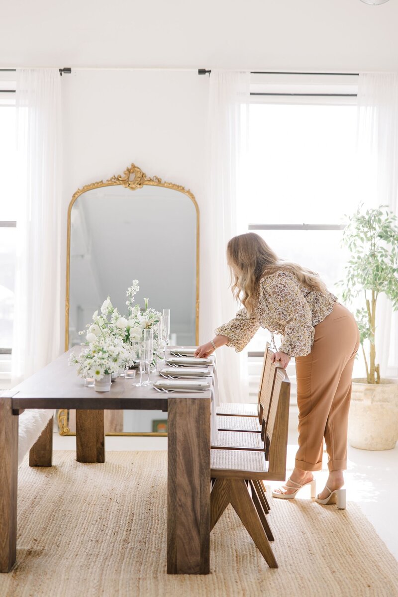 Carissa setting up a tablescape