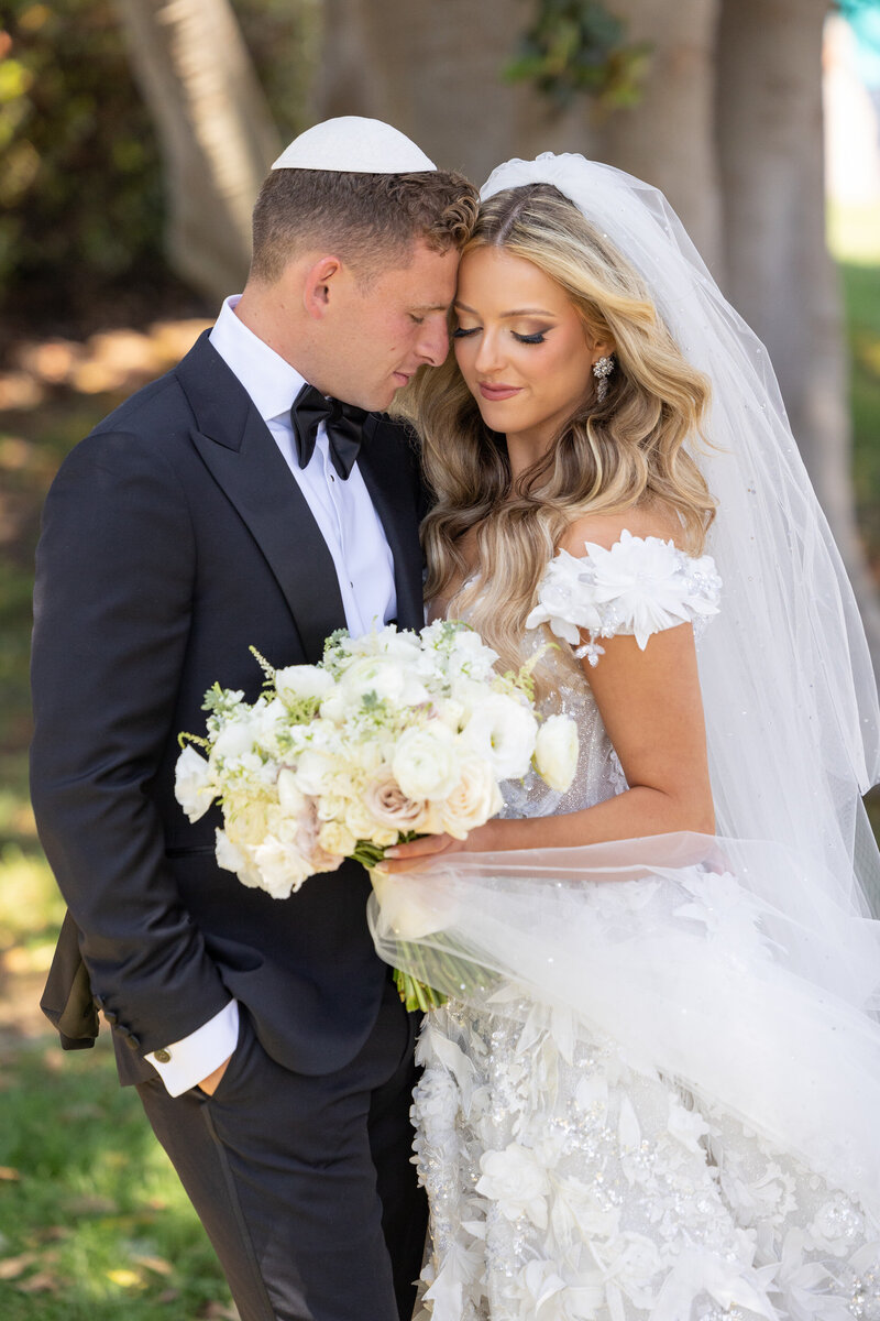 A bride and groom about to kiss