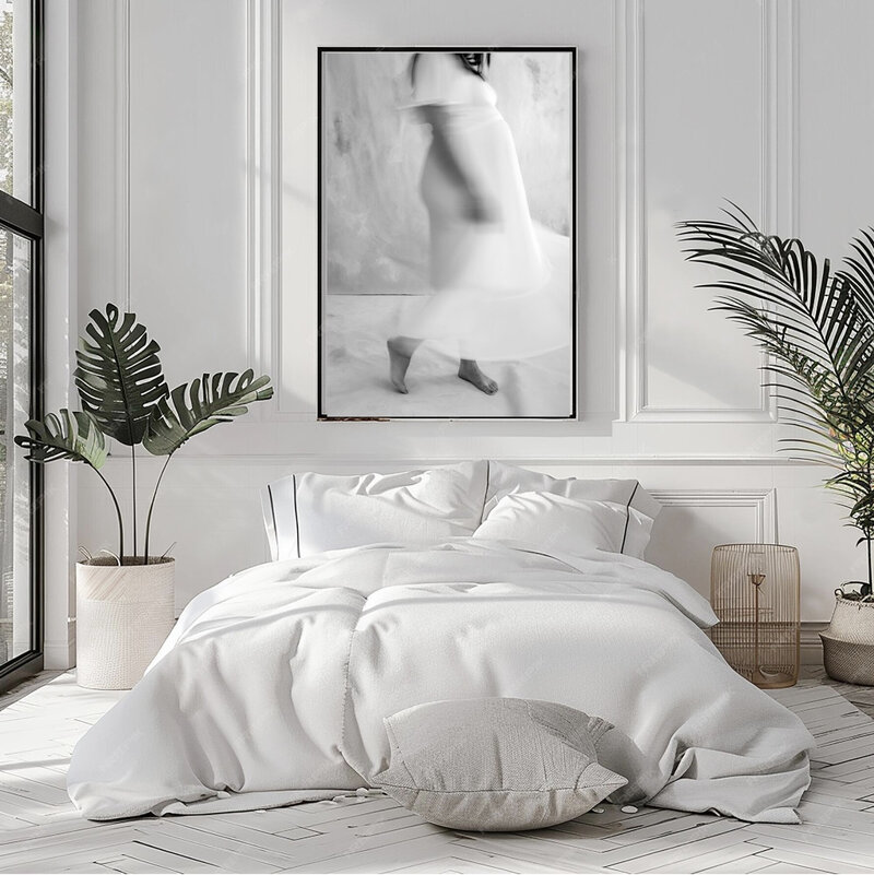 Framed black and white maternity portrait displayed in a modern white bedroom, showing a printed artwork option by Suzanne Karp from Little Palm Studio in San Rafael California.