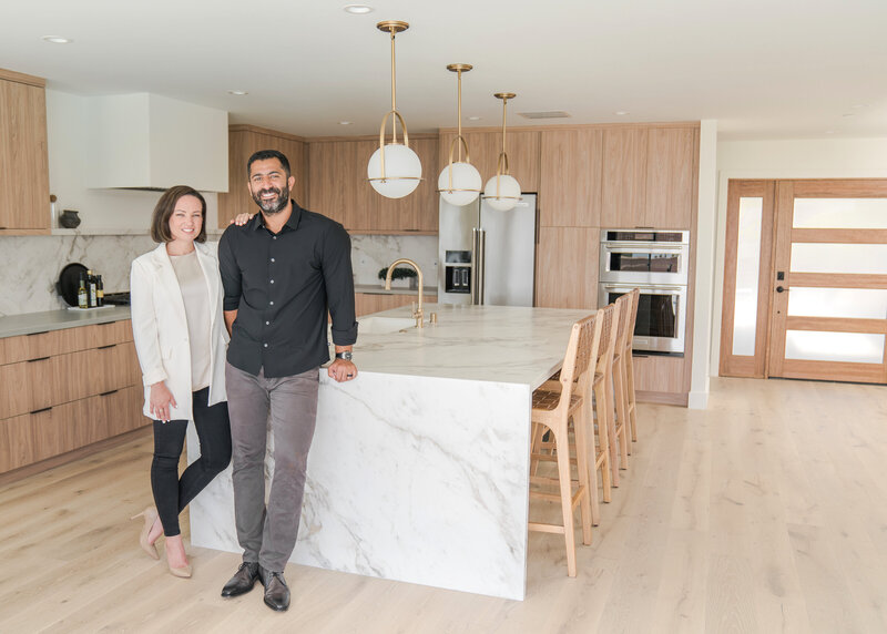 Man and Woman Standing in Modern Design Open Kitchen Concept