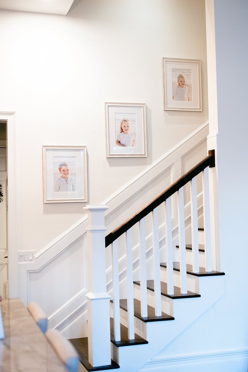 A stairway with framed pictures on it in North Carolina