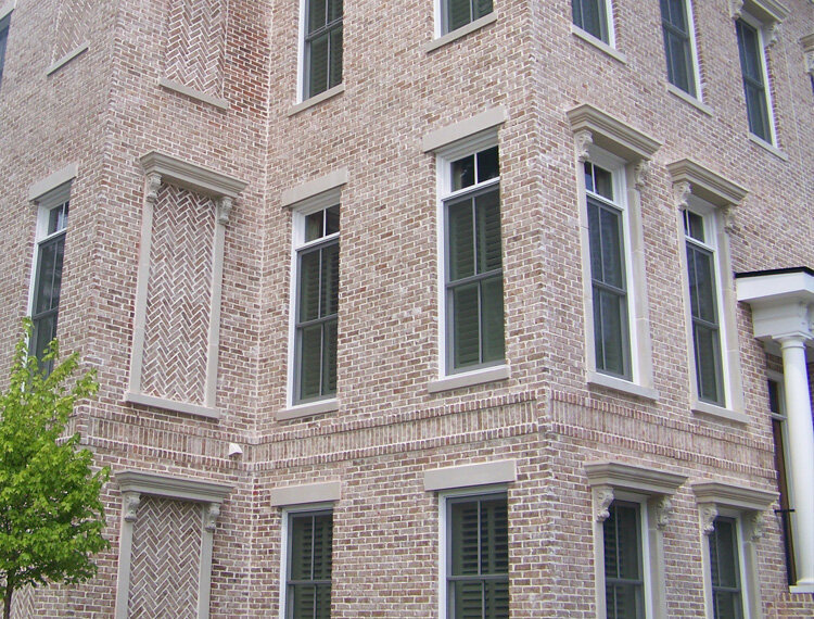 Elegant brick building with traditional window surrounds