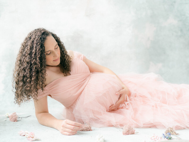 Sweet maternity moments at home with toddlers—captured by Riverton maternity photographer.