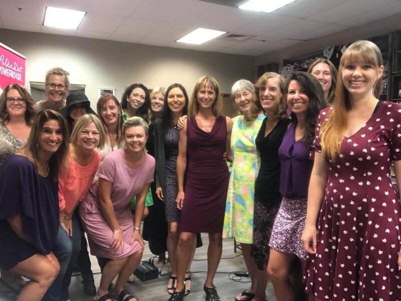 Woman surrounded by happy event attendees