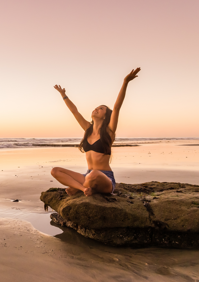 Woman Meditating on the beach