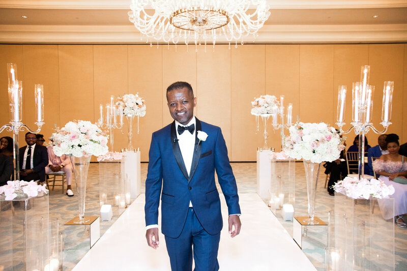 st-regis-atlanta-wedding-groom-walking-aisle-floral-decor