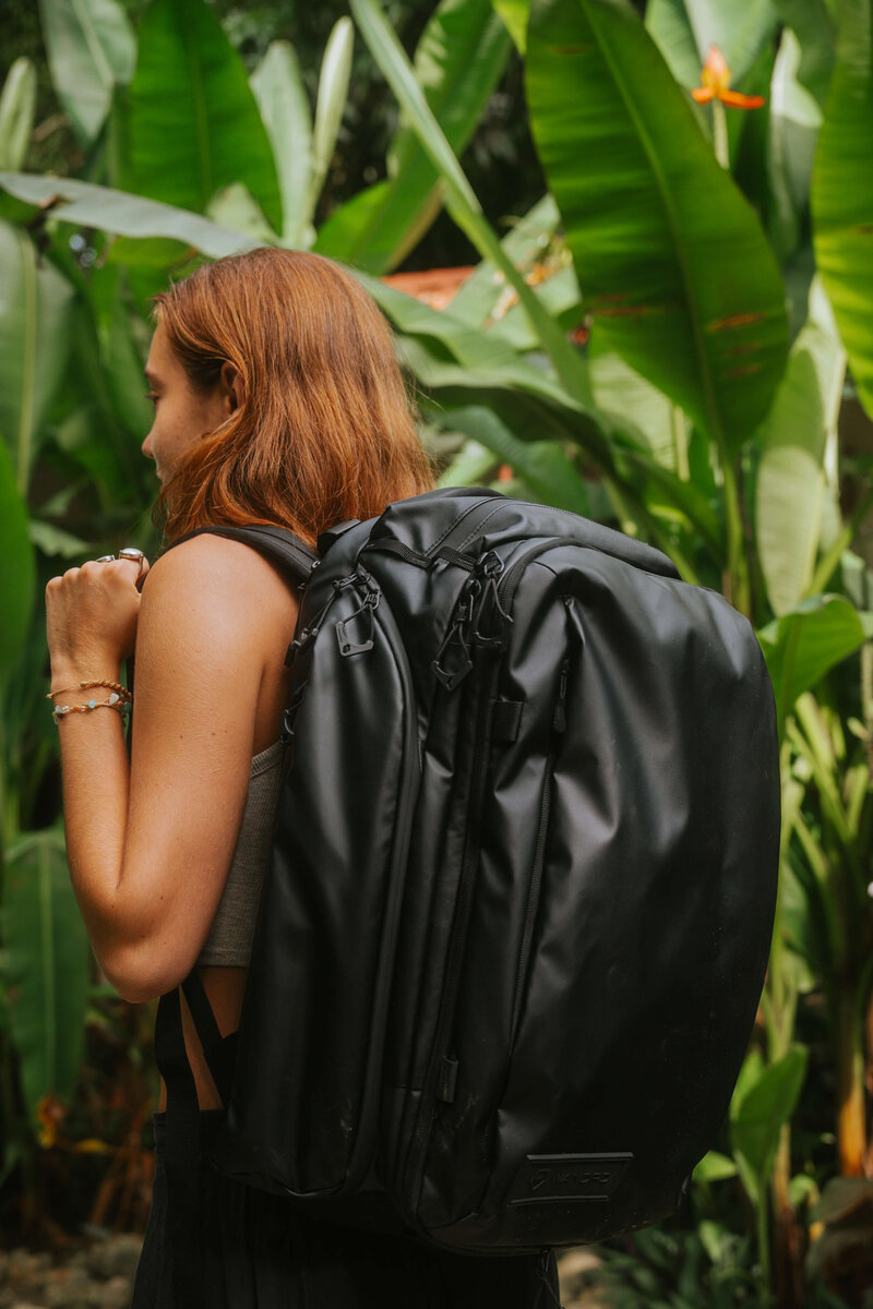Gil with black travel backpack