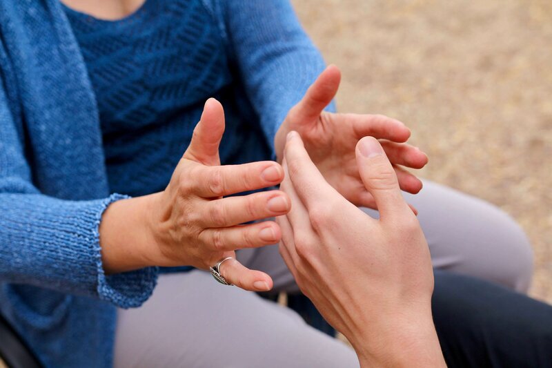 The hands of energy healer, Lori Harger, and a client during a Heart-Energy Healing session