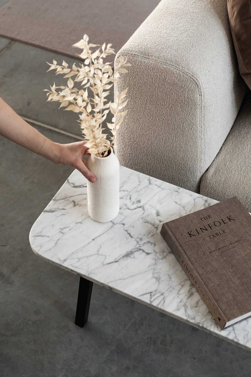 kaboompics_marble-table-books-light-beige-sofa-boucle-padova-kinfolk-25048