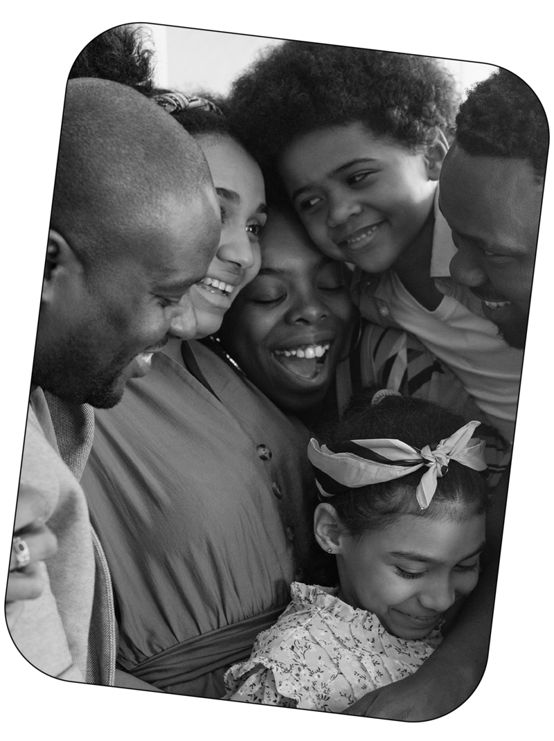 Black and white image of a family smiling