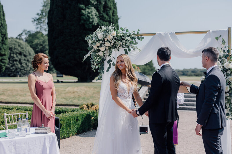 bride-andgroom-saying-vows-at-outdoor-ceremony-cork