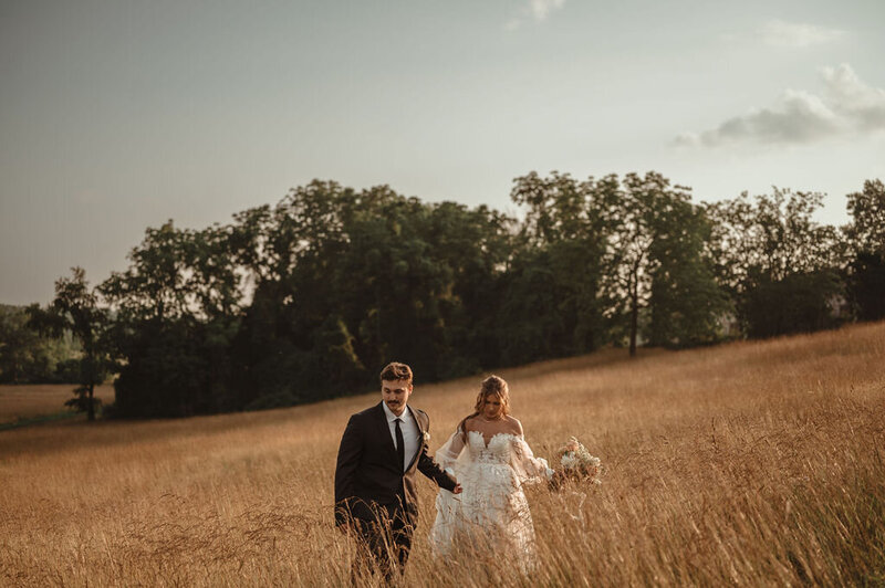 Couple sharing a romantic moment in a field during their elopement near Doylestown, Pennsylvania