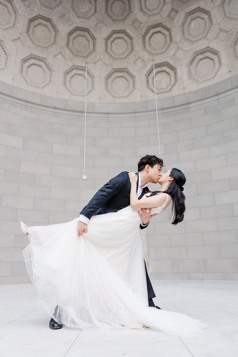 Groom dips his bride during their elopement portraits