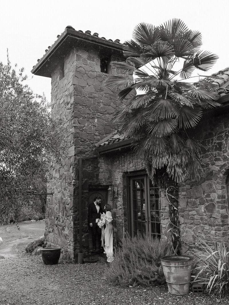black and white portrait of bride and groom at acre baja
