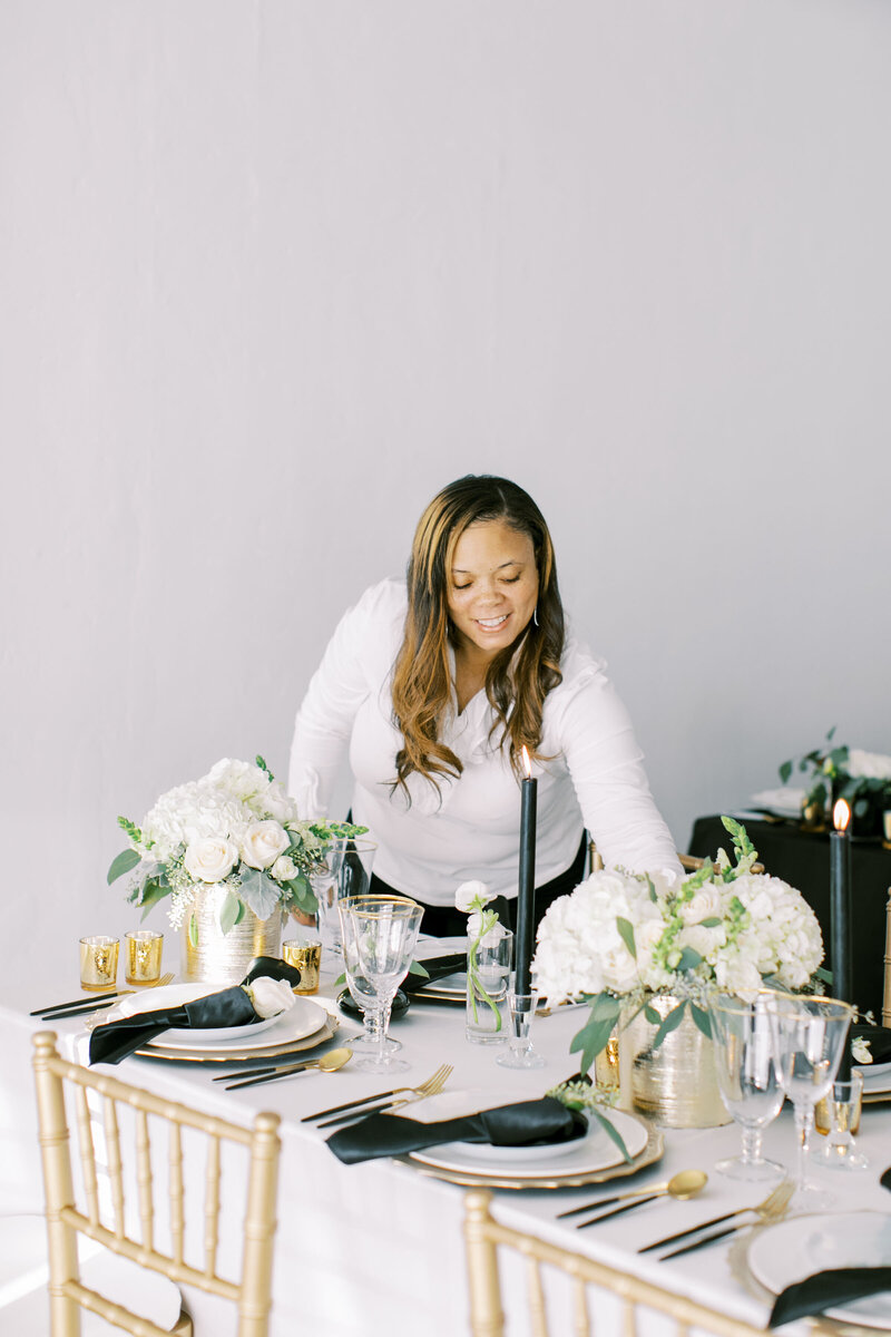 Luxury wedding planner creating tablescape