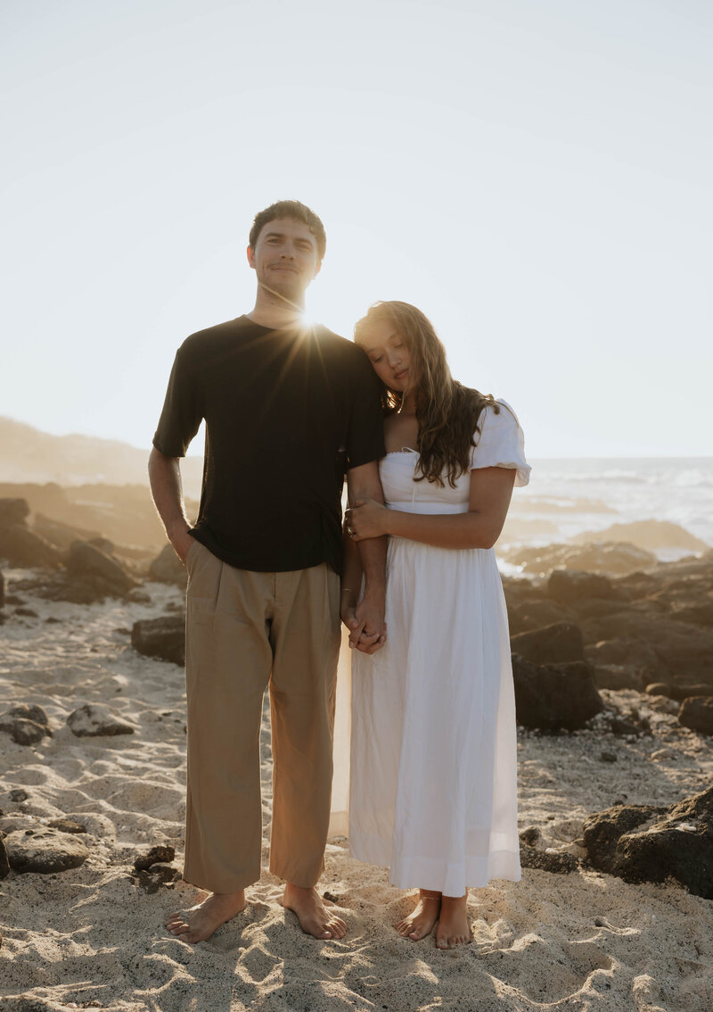 destination elopement photography  in hawaii bride and groom holding hands eloping on the beach