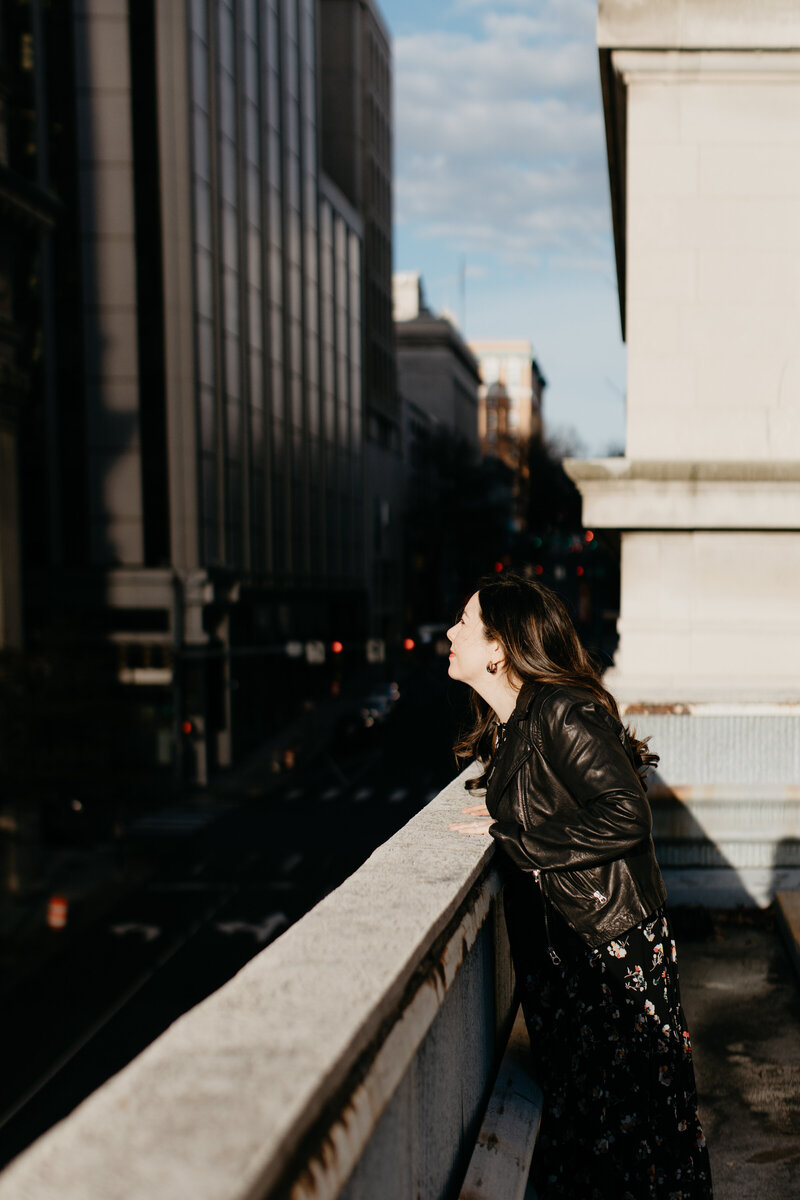Money mindset coach, Jenny Whichello, takes a mindful moment to take in the views of the city below.