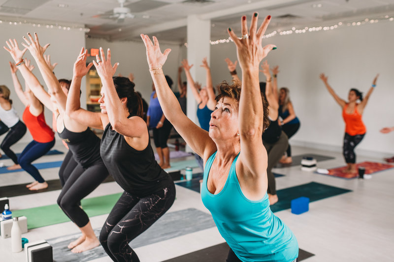 Branding Photographer, women do yoga in a yoga studio
