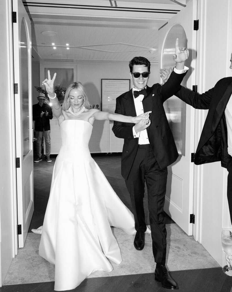 Couple making a grand entrance, reflecting LIMCO's easy and natural learning approach for a relaxed and special wedding day.