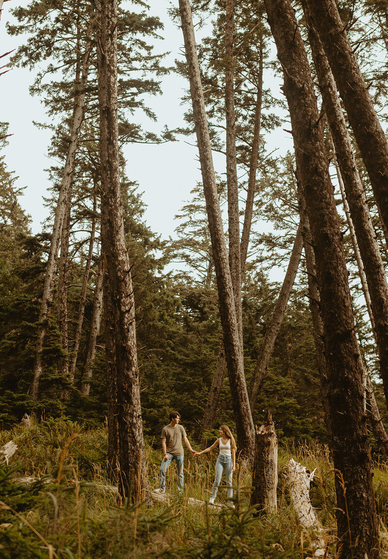couple standing in forest together