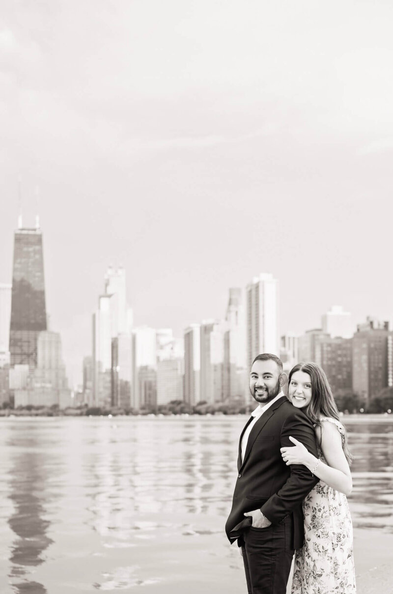 chicago engagement photo of couple with chicago skyline in background