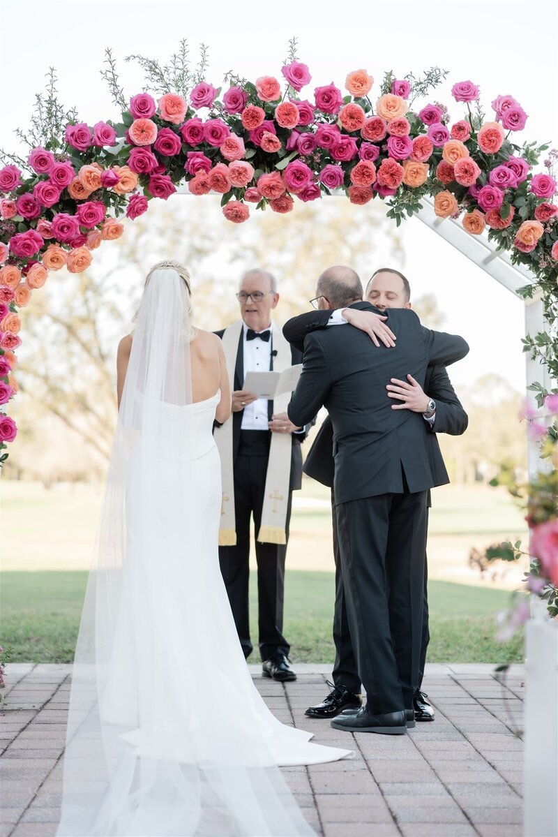 wedding ceremony at the country club of orlando by orlando wedding photographer
