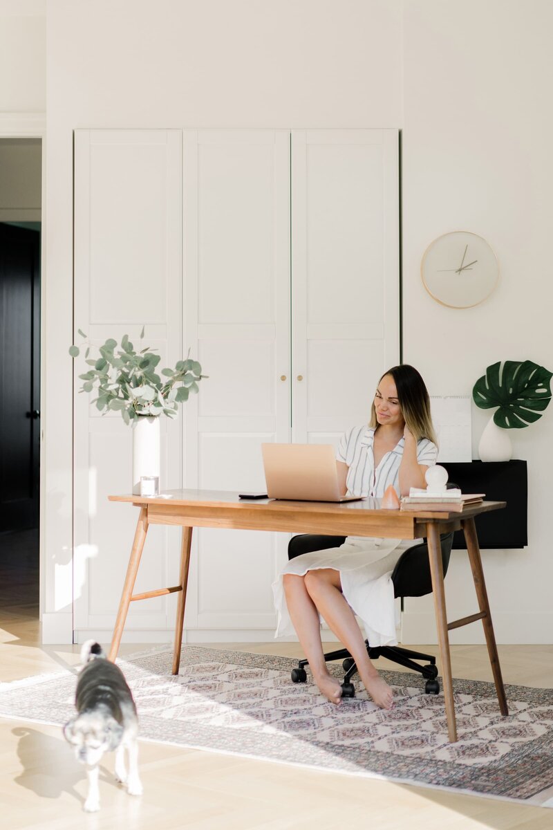 Modern desk flatlay with a computer, iphone, and coffee
