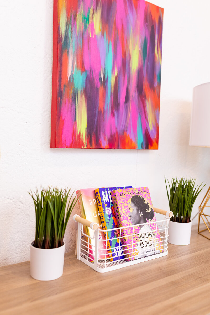 end table of greenery and books