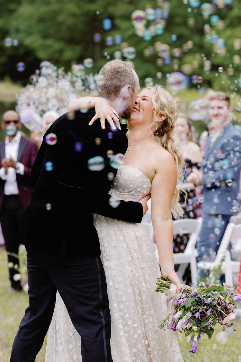 outdoor lakeside wedding bubble exit