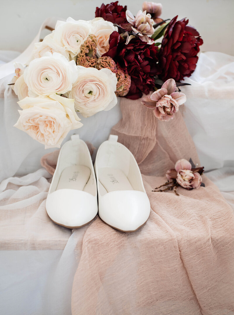 Cute bridal details of Intimate Micro Wedding styled shoot of wedding bouquet, bridal shoes, and boutonniere