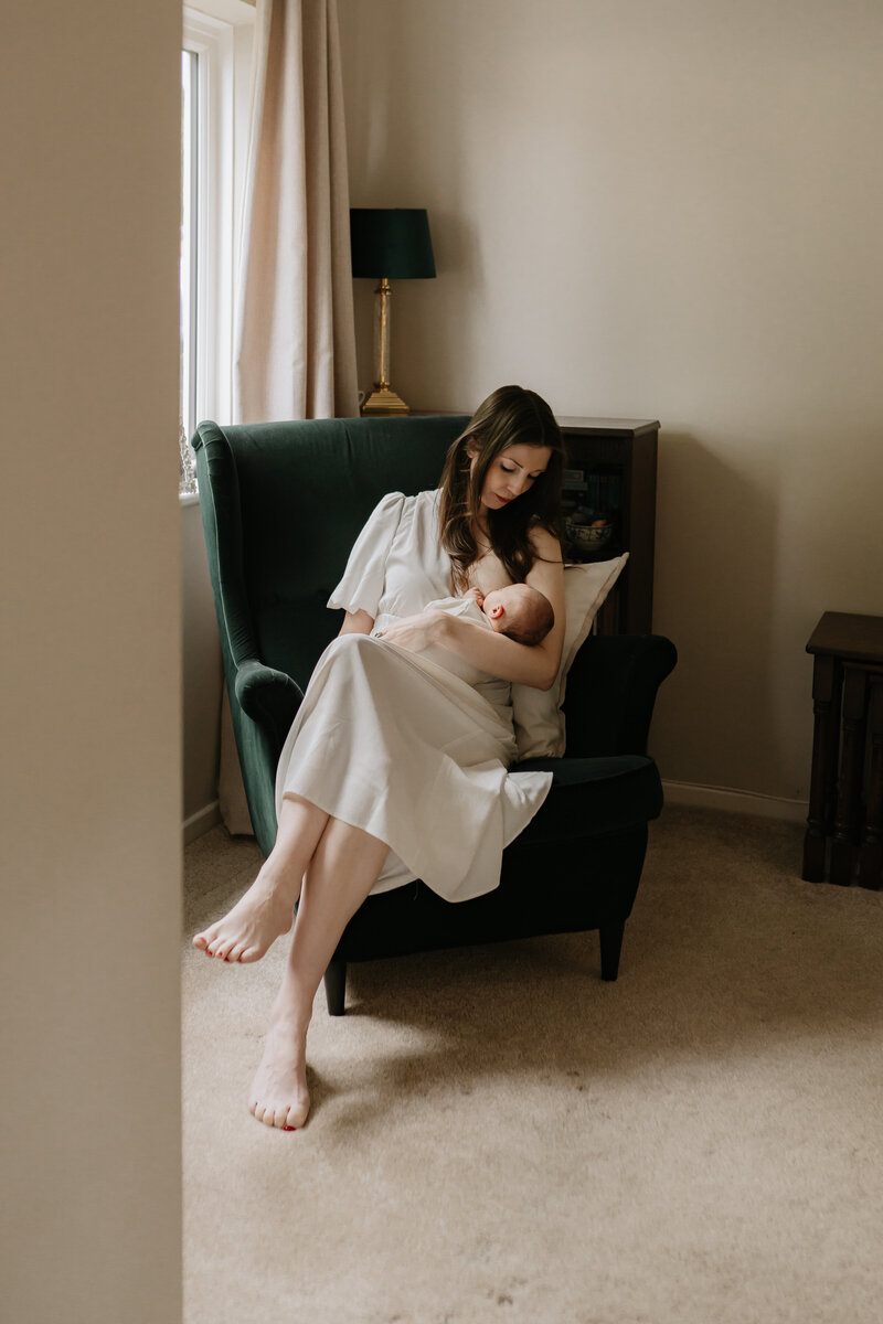 Worcestershire Newborn Photographer with mum at home with newborn