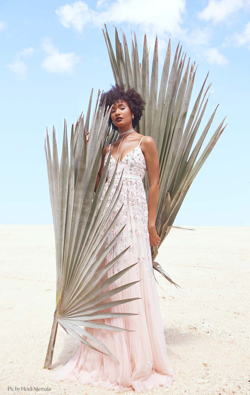 This is a model who was being photographed with some palm leaves in the Cayman Islands