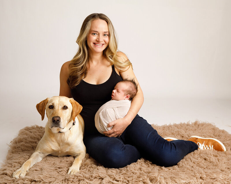 Newborn with mom and dog