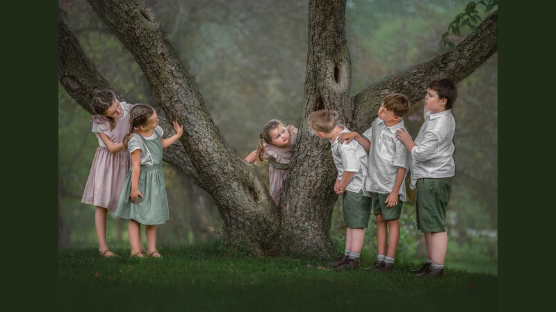 "A family captured in the beauty of nature during an outdoor portrait session in Ottawa, showcasing love and togetherness."